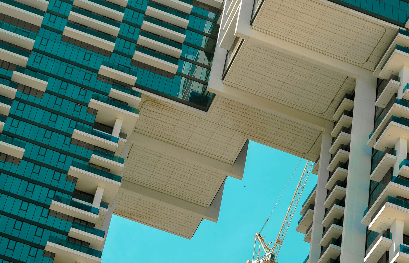 Modern high-rise buildings and an active construction site in Dubai