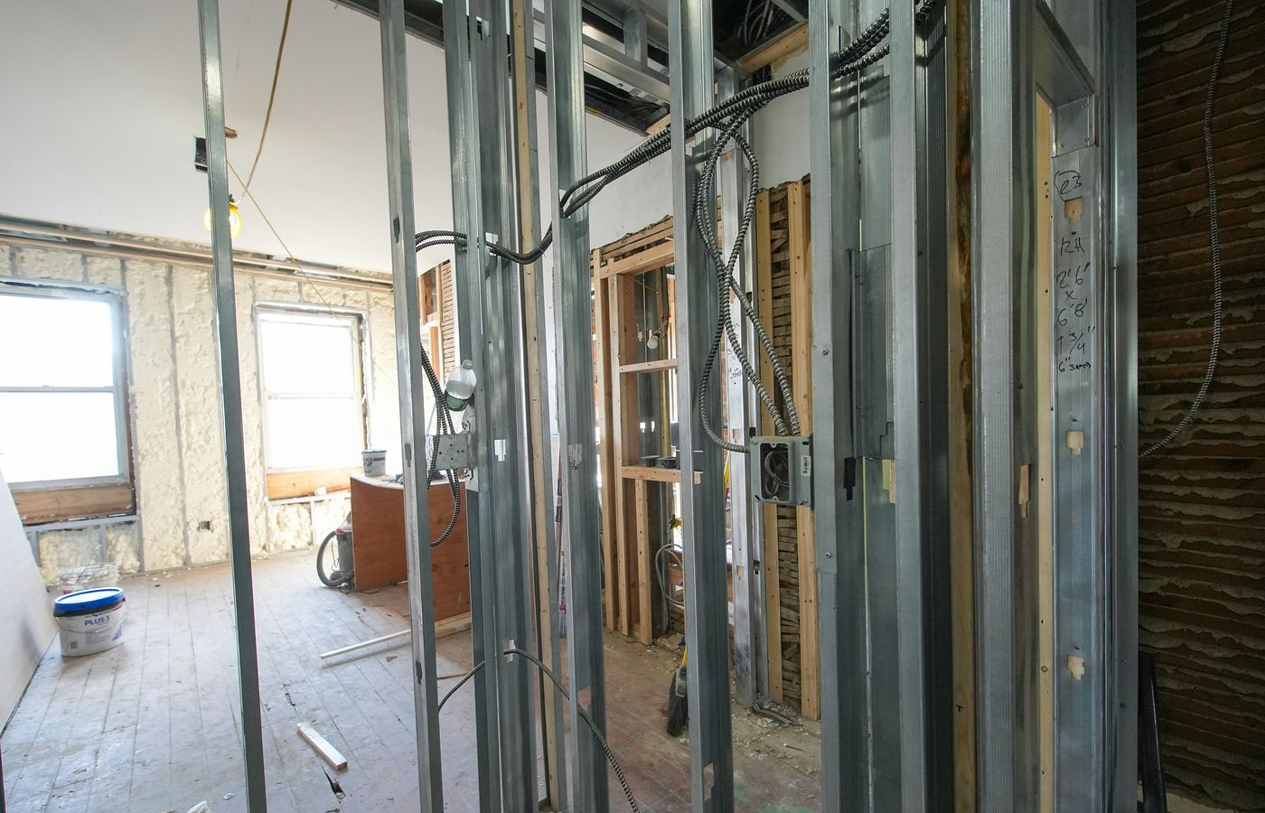 Building interior with metal framing and electrical wiring during technical works